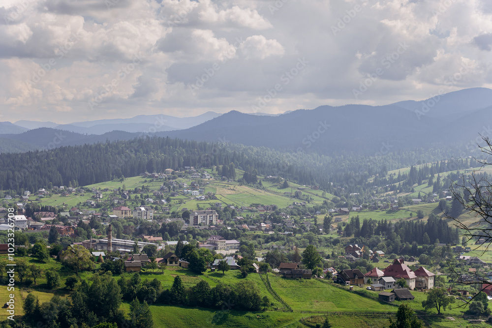 Naklejka premium Scenic landscape view of Vorokhta, picturesque mountain village with green hills and forests