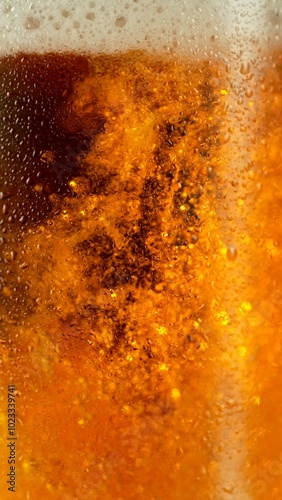 Close-up of beer pouring in...