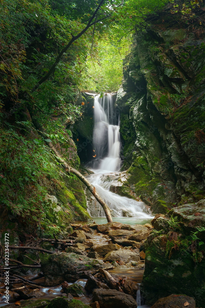 A magnificent waterfall in the warm sunlight A magnificent waterfall in the warm sunlight