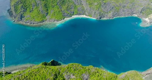 Beautiful Blue Sea between Tapiutan Island and Matinloc Island with beaches. El Nido, Palawan. Philippines. photo