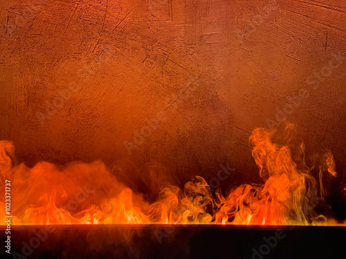 Bright flame against a concrete wall