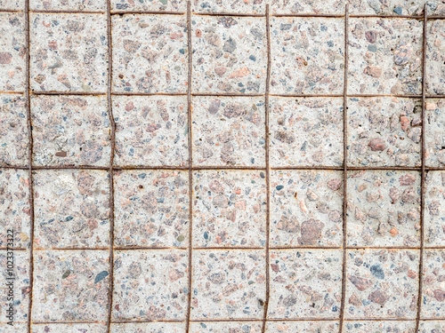 Surface of a concrete slab with a worn surface and a reinforcement mesh