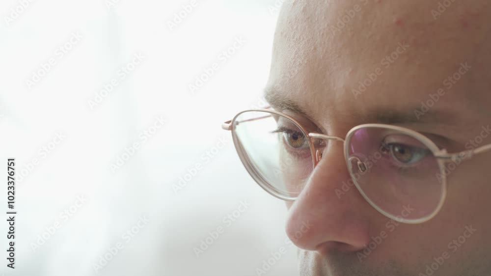 student in glasses, attending online class, focused programmer with glasses, working, Concept coding and software development, remote learning and e-education student in glasses, attending online class, focused programmer with glasses, working, Concept coding and software development, remote learning and e-education