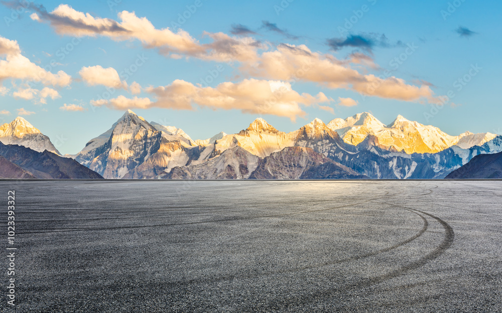 Asphalt road square and snow mountain natural landscape at sunset. Car background.