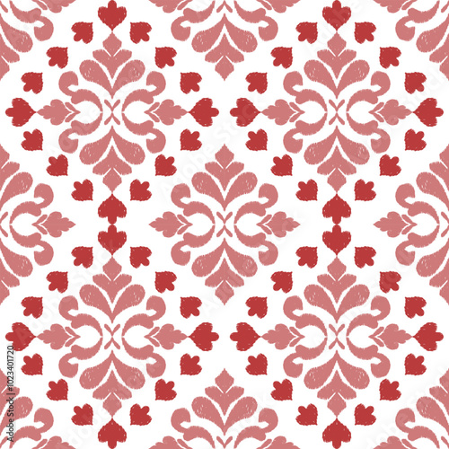 A seamless ikat floral pattern in shades of red and pink, featuring traditional geometric motifs. This vibrant design is perfect for fabric, home decor, and textile projects, adding a bold, cultural 