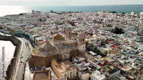 Circular drone video over the cathedral of the city of Cadiz, Andalucia, Spain.