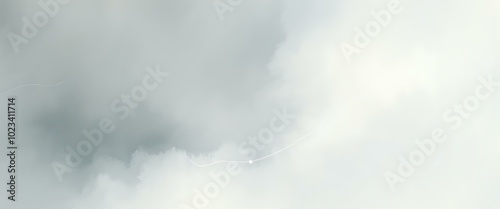 Serene Cloudy Day with White Fluffy Clouds against a Gray Sky, Tranquil Scene