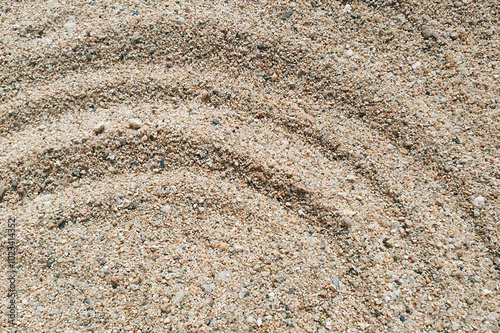 Reinbow print on the sand near a sea. photo