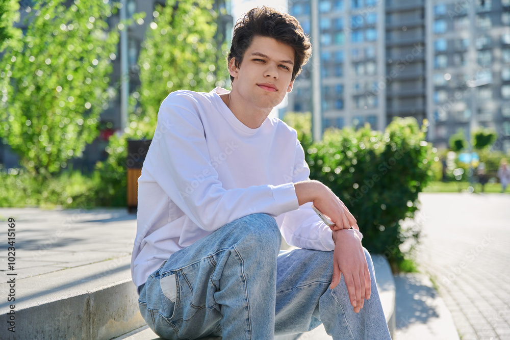 Fototapeta premium Outdoor, portrait smiling handsome young male 19-20 years old