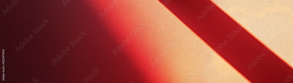 Fototapeta premium Diagonal Shadow on Textured Wall with Red and Orange Hues