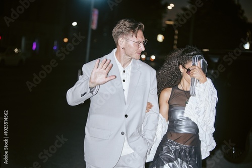 Fotografie Medium shot of fashionable mature male celebrity hiding with hand from photograp