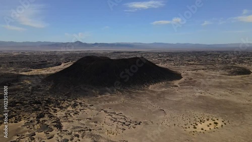 Wallpaper Mural Aerial drone footage of a black lava crater in the middle of an arid desert in California, USA Torontodigital.ca