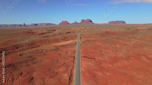 Wallpaper Mural Aerial drone footage of a long road in the red rock desert  on a clear day in Utah, USA Torontodigital.ca