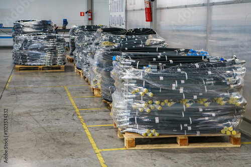 High pressure hoses packed in film and ready for shipment. High pressure hose pallets.