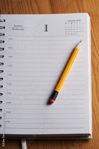 2025 diary on page of January with yellow pencil