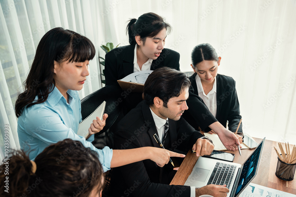 Diverse of business people from various ethnic group working in modern office environment. Productive and multi ethnic office workers engage in discussion for strategic business marketing. Habiliment Diverse of business people from various ethnic group working in modern office environment. Productive and multi ethnic office workers engage in discussion for strategic business marketing. Habiliment