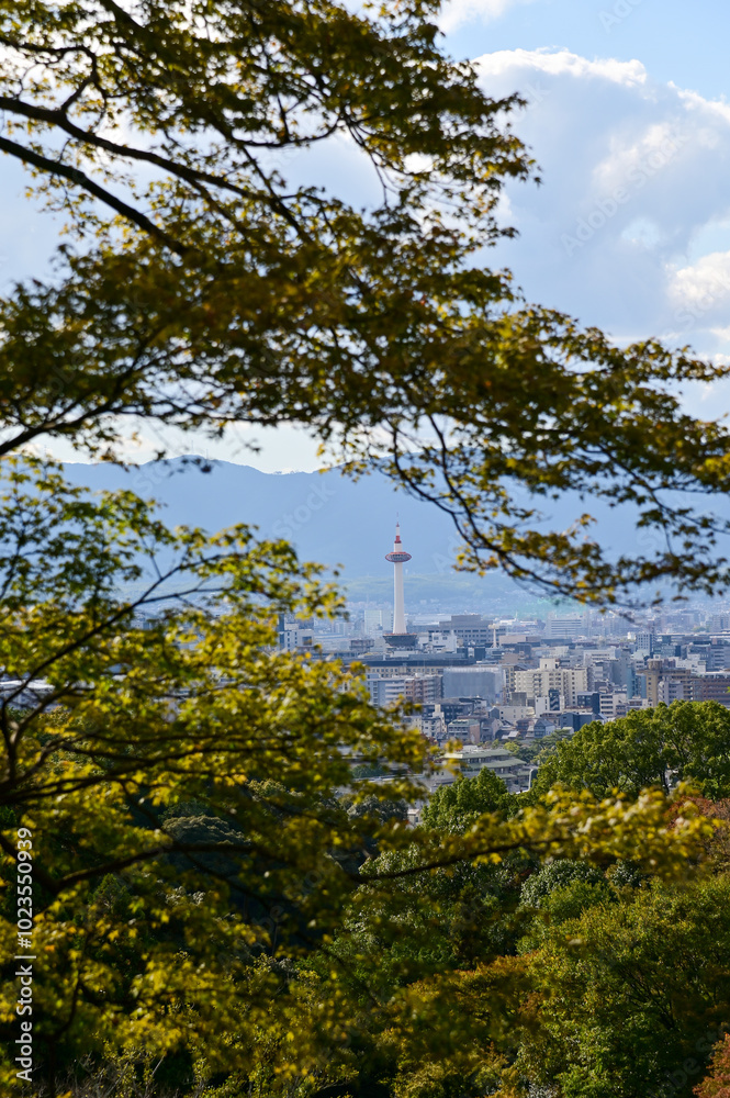 The view of Kyoto city skyline with blue sky and trees from kiyomizu-dera temple in Kyoto, Japan. Major tourist attraction in Kansai region in Japan. Travel concept. Japan cityscape. The view of Kyoto city skyline with blue sky and trees from kiyomizu-dera temple in Kyoto, Japan. Major tourist attraction in Kansai region in Japan. Travel concept. Japan cityscape.