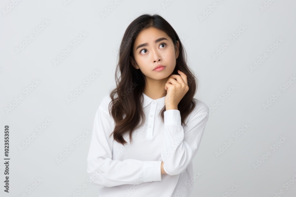 Woman with confused face portrait white photo. Woman with confused face portrait white photo.