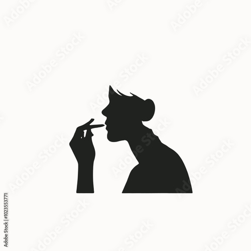 A silhouette of a person smoking a cigarette