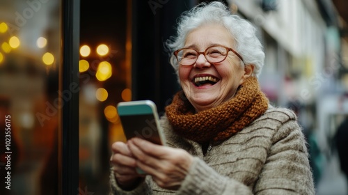 elderly woman laughing with smartphone