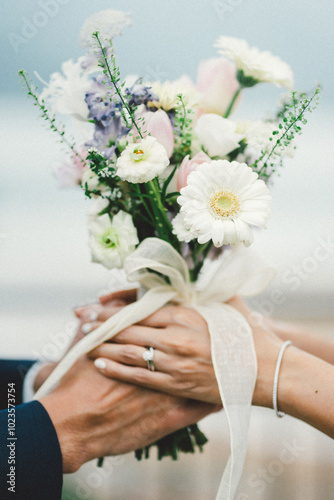 bride and groom holding hands