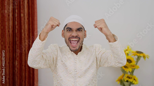 Happy Muslim Man Cheering photo