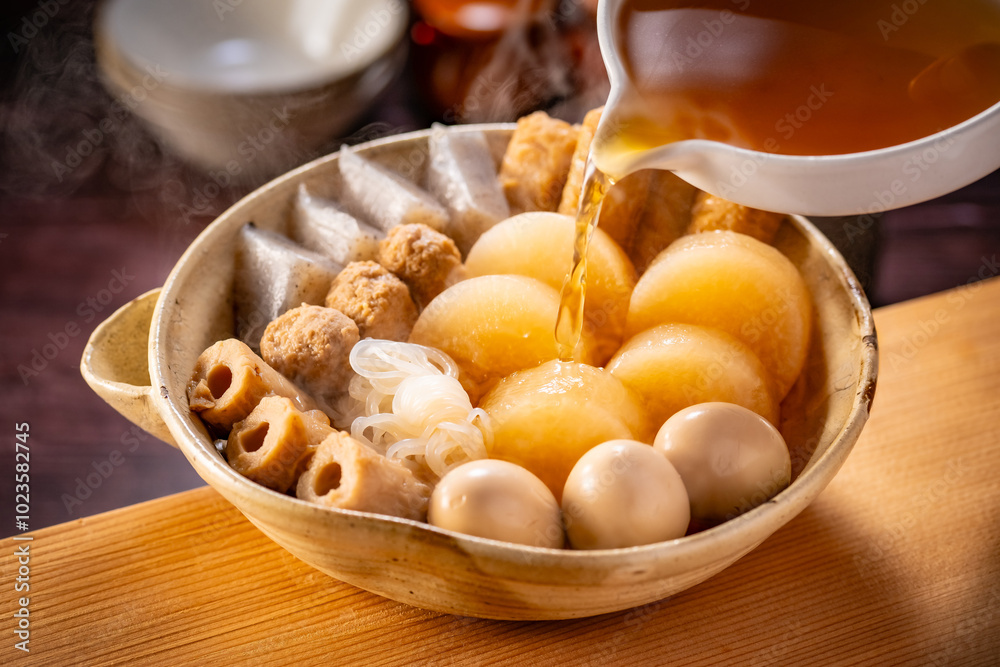 Japanese Oden, fish cake and vegetable stew.
Oden is a stew made with boiled eggs, radish (daikon), fish cakes and stock (dashi). Japanese Oden, fish cake and vegetable stew.
Oden is a stew made with boiled eggs, radish (daikon), fish cakes and stock (dashi).