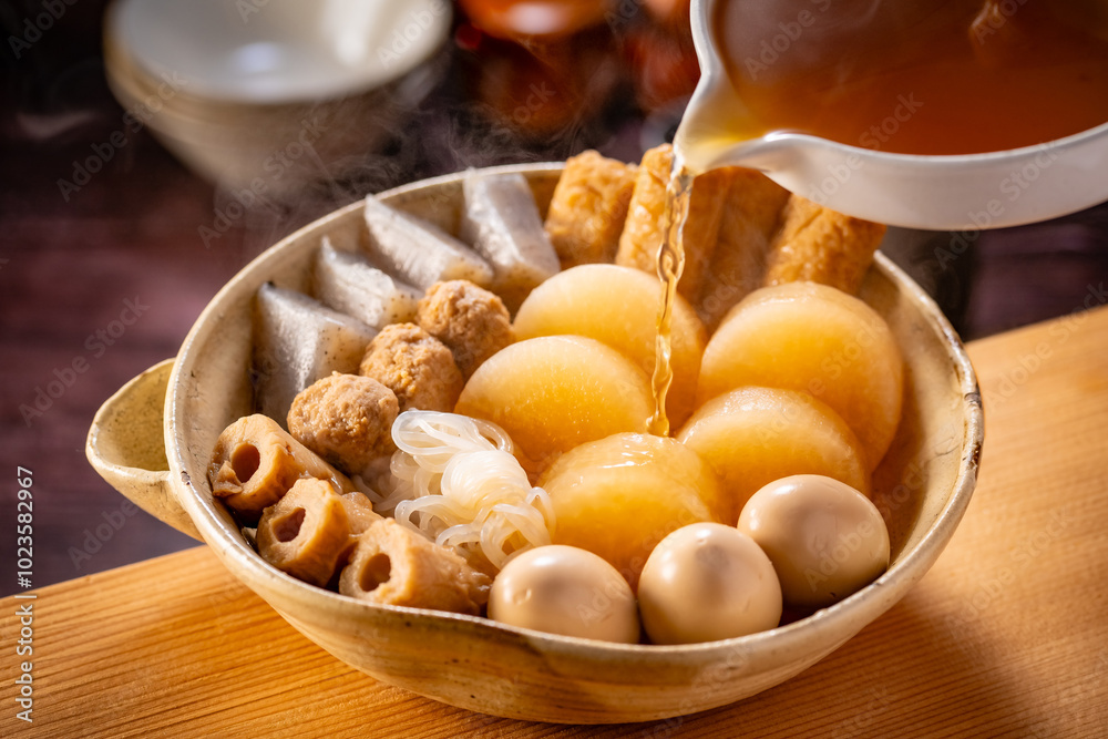 Japanese Oden, fish cake and vegetable stew.
Oden is a stew made with boiled eggs, radish (daikon), fish cakes and stock (dashi). Japanese Oden, fish cake and vegetable stew.
Oden is a stew made with boiled eggs, radish (daikon), fish cakes and stock (dashi).