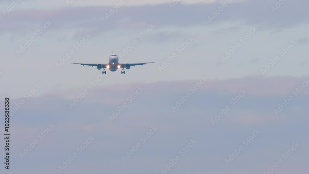 Unknown jet aircraft descending for landing, approaching. Airliner in the sky. Travel concept Unknown jet aircraft descending for landing, approaching. Airliner in the sky. Travel concept