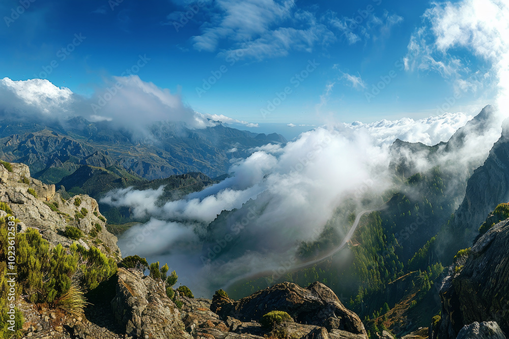 The sky is blue and the mountains are covered in clouds The sky is blue and the mountains are covered in clouds