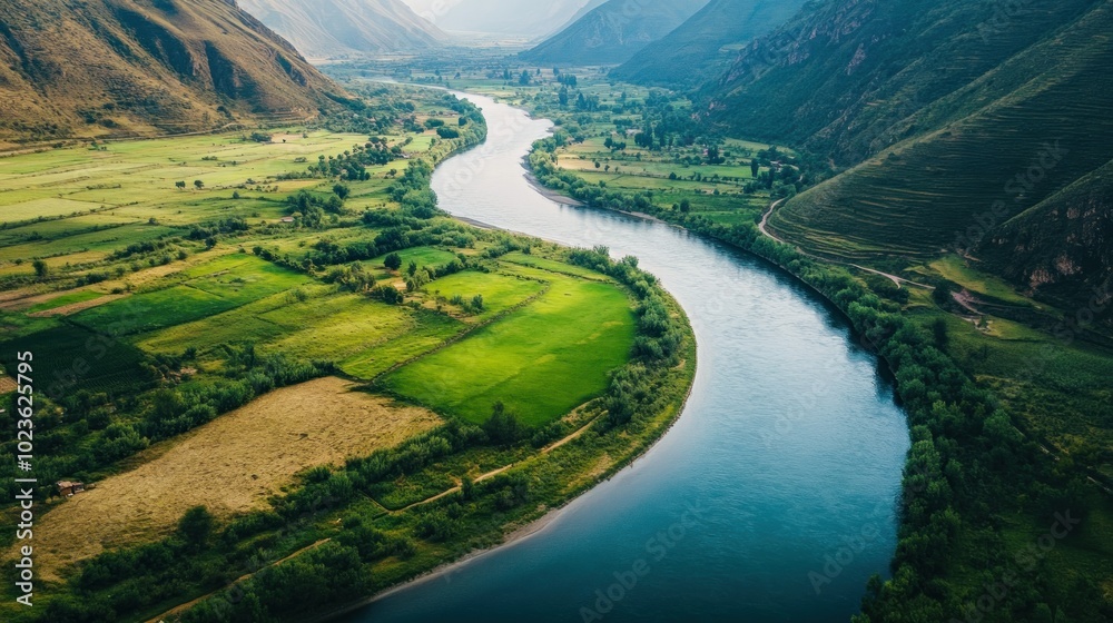 Aerial View of a River Winding Through a Lush Green Valley Aerial View of a River Winding Through a Lush Green Valley