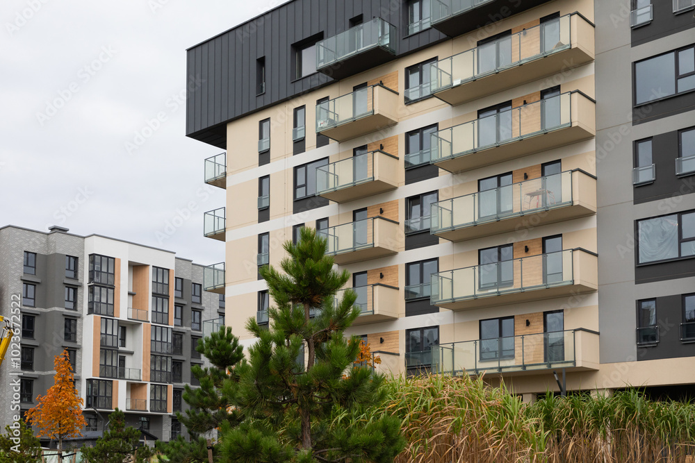 Fototapeta premium New high-rise residential buildings showcasing modern architecture and rental opportunities in an urban neighborhood