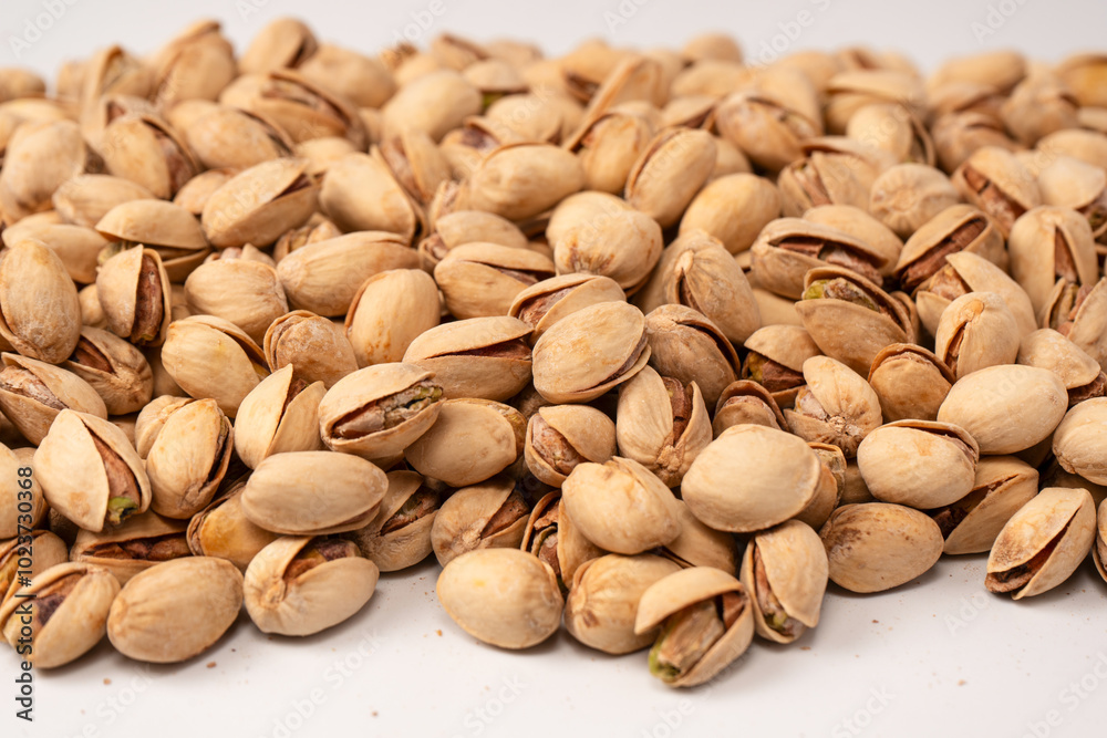 Tasty pistachios isolated on a white background. Tasty pistachios isolated on a white background.