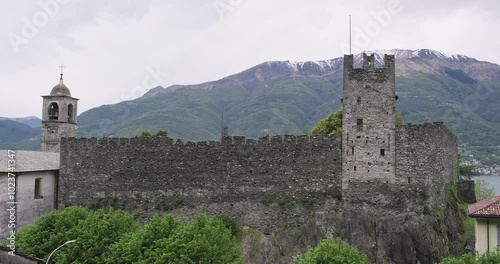 Lake Como, Dervio, Italy. Castle of Corenno Plinio on a cloudy day. Travel vacations in Italian Alps photo