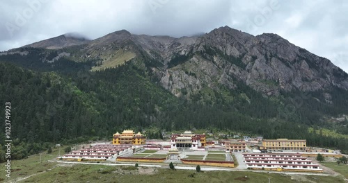 Aerial footage of Lenggu Monastery in beautiful high altitude mountains landscape