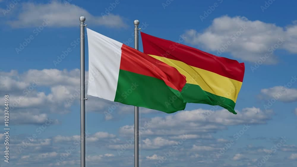 Bolivia and Madagascar flags flying together, video concept of the relationship, two country relations concept Bolivia and Madagascar flags flying together, video concept of the relationship, two country relations concept