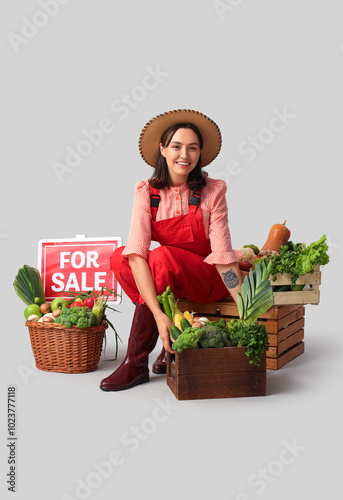 Female farmer with fresh ve...
