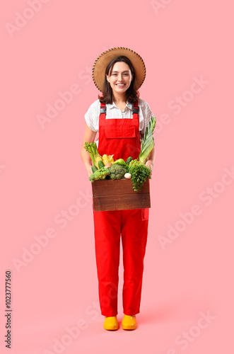 Female farmer with fresh ve...