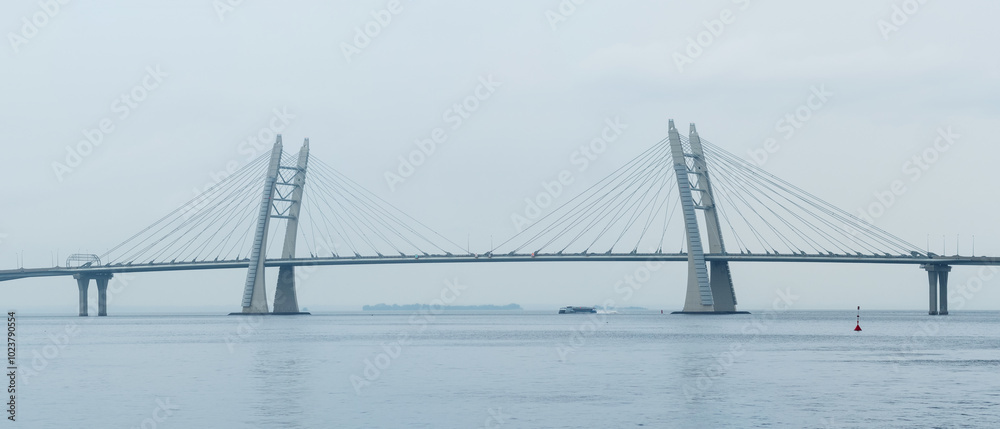 distant bridge over foggy bay on rainy day distant bridge over foggy bay on rainy day
