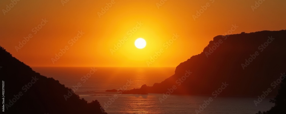 A stunning sunset over a tranquil ocean, framed by coastal cliffs, perfect for travel, relaxation, and nature-themed projects. A stunning sunset over a tranquil ocean, framed by coastal cliffs, perfect for travel, relaxation, and nature-themed projects.