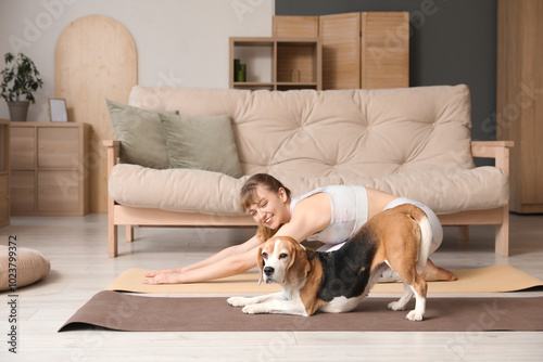 Young woman exercising with...