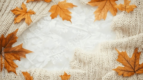 Autumn Cozy Vibes: Beige Knit Sweater and Golden Maple Leaves Flat Lay 