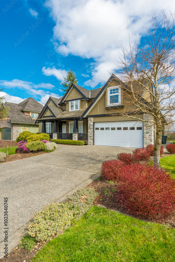 Fragment of a luxury house with a garage door in Vancouver, Canada. Horizontal orientation. Fragment of a luxury house with a garage door in Vancouver, Canada. Horizontal orientation.