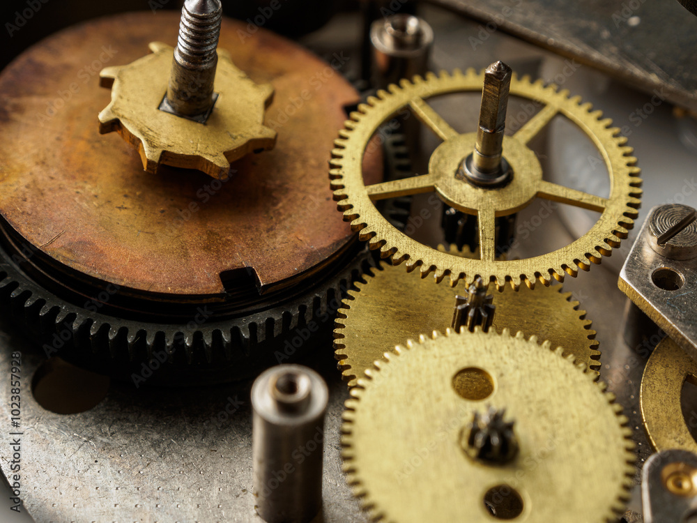 Close-up of a mechanical device with gears and teeth, demonstrating the complexity of repairing and assembling a watch movement Close-up of a mechanical device with gears and teeth, demonstrating the complexity of repairing and assembling a watch movement