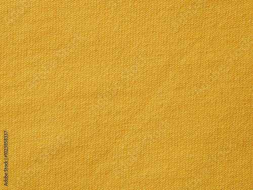 A close-up of bright yellow fabric with a textured pattern, adding brightness and liveliness, perfect for the design