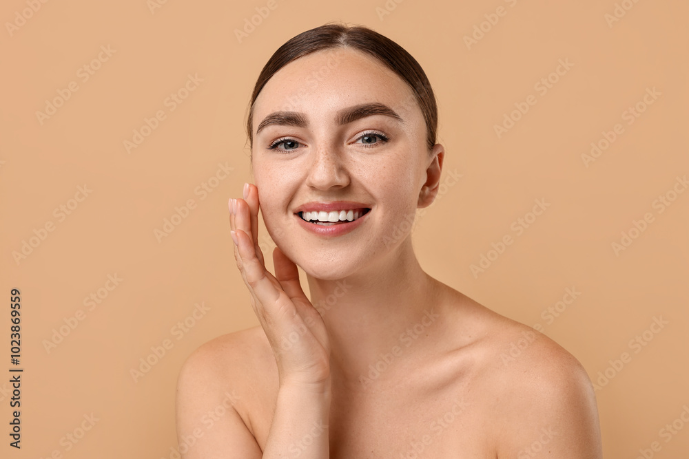 Beautiful young woman with healthy skin on beige background Beautiful young woman with healthy skin on beige background