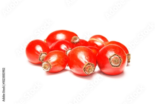 Rose Hip berries close up, a pile of Rose Hip berries isolated on white background photo