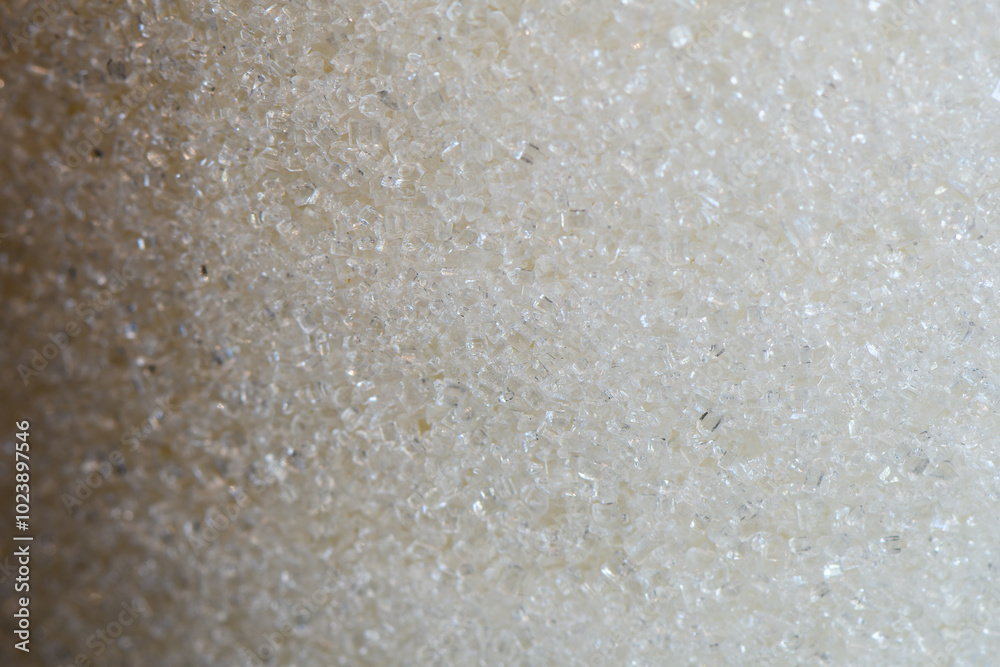 Close-up of Granulated Sugar Crystals. Detailed macro shot of texture and clarity of white granulated sugar crystals. Abstract background with sugar grains Close-up of Granulated Sugar Crystals. Detailed macro shot of texture and clarity of white granulated sugar crystals. Abstract background with sugar grains