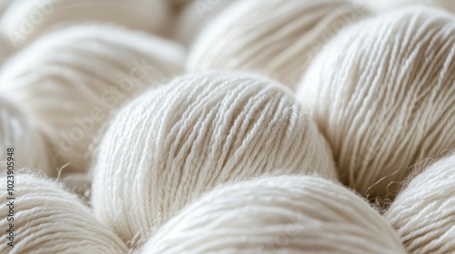 Close-up of a group of white yarn balls.