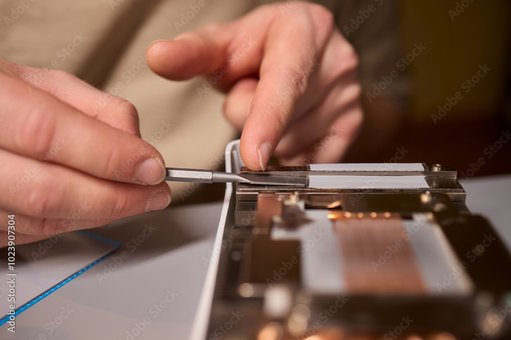 Hand Repairing a Graphics Card through the Application of Thermal Paste for Better Performance Hand Repairing a Graphics Card through the Application of Thermal Paste for Better Performance